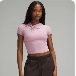 Lululemon NWOT Asymmetrical Front-
Twist T-Shirt Rose Blush
Size XL